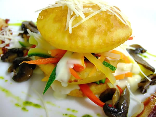 Lasagne of fried potatoes with vegetables and Brie sauce