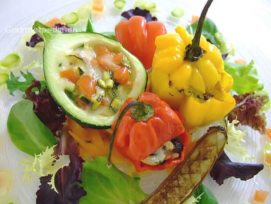 Stuffed courgettes and peppers on marinated salad with asparagus vinaigrette