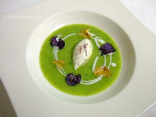 Cream of herb soup with fresh cheese quenelle