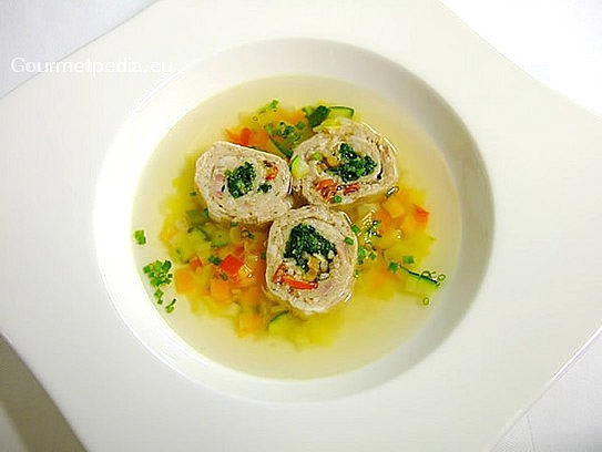 Consommé with vegetables and stuffed roll of kid