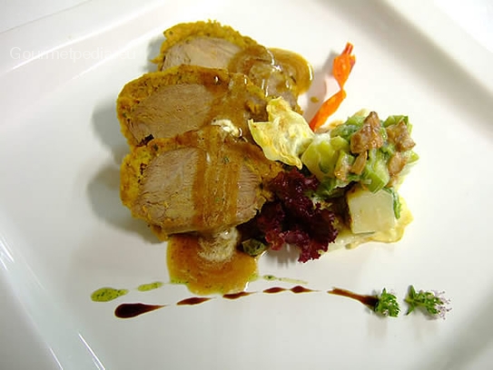 Roast veal in a herb crust with leek vegetables with chanterelles