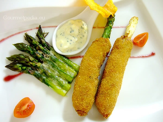 Fried asparagus in a meat coat with tartare sauce