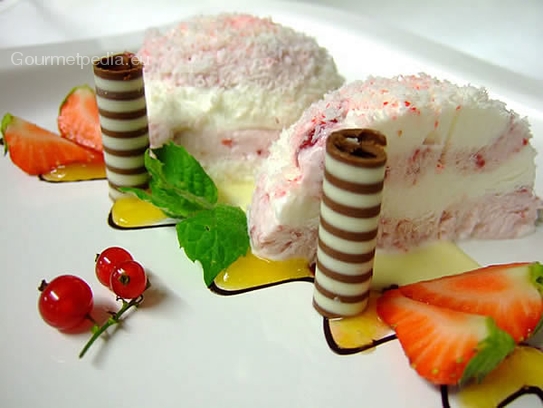 Strawberry parfait in coconut on white chocolate sauce