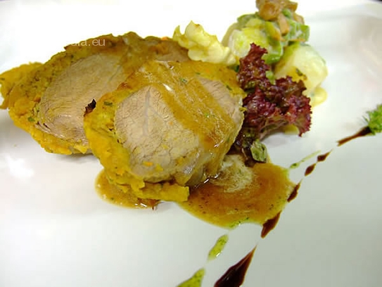 Roast veal in a herb crust with leek vegetables with chanterelles