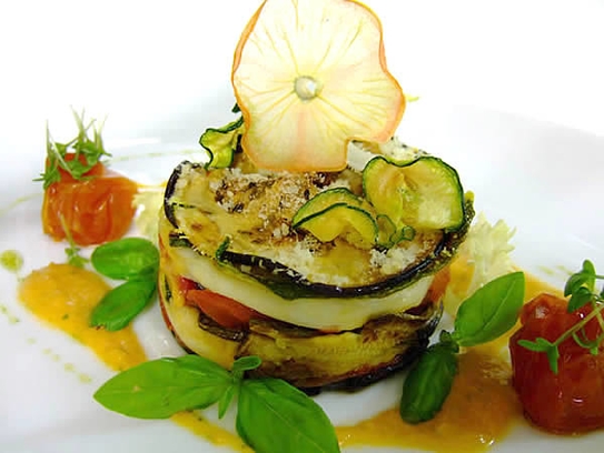 Aubergines timbale with mozzarella and tomatoes au gratin
