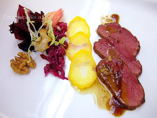 Saddle of venison on marinated red cabbage salad with walnut gravy