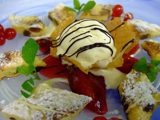 Browned omelette with stewed plums and vanilla ice-cream