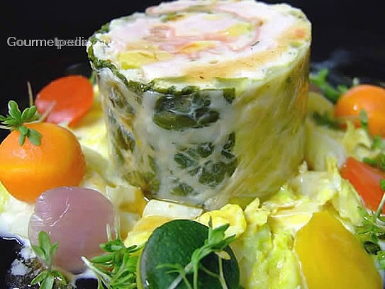 Roulade de turkey in Savoy cabbage with ham on creamed Savoy with vegetables