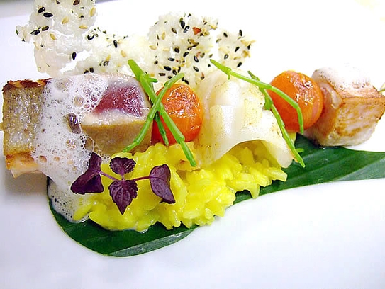 Fish brochette on banana leave with turmeric risotto and kaffir lime foam