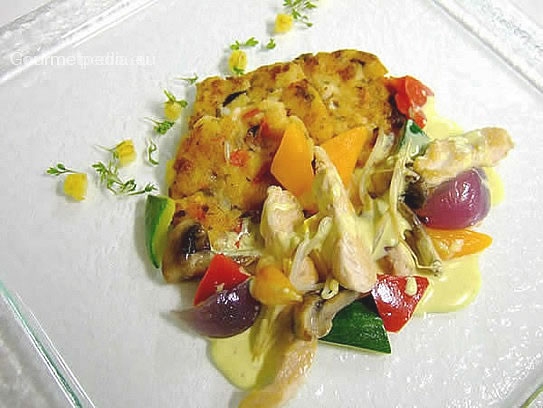 Stroganoff of chicken and vegetables on potato cakes