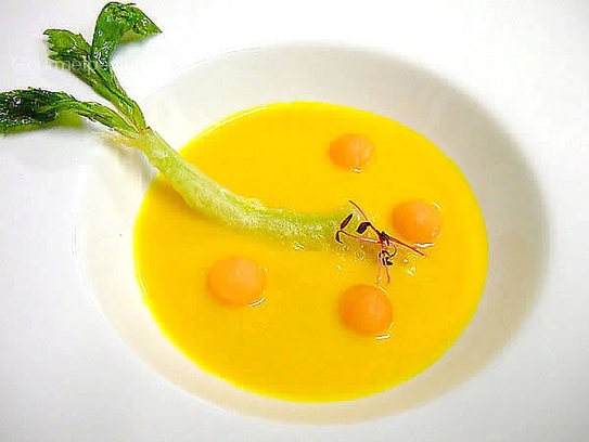 Cream of melon and carrot soup with celery in tempura