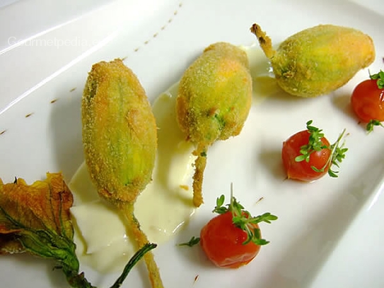 Fried stuffed squash blossoms on mornay sauce