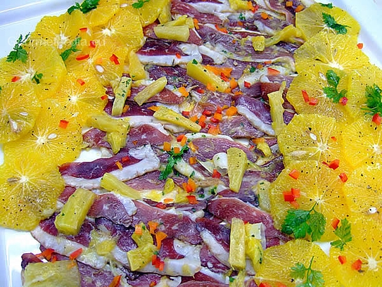 Suprême de canard fumé à la vinaigrette à l’orange