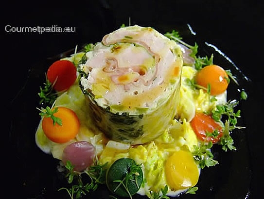 Roulade de turkey in Savoy cabbage with ham on creamed Savoy with vegetables