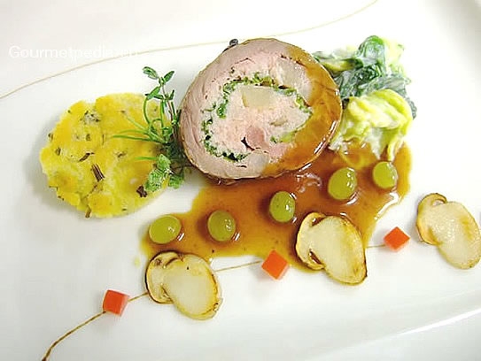Stuffed roll of venison with grapes sauce and grilled yellow boletus mushrooms