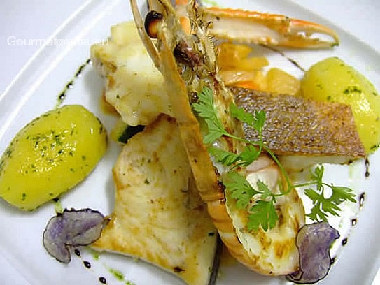 Grilled seafish on vegetables and boiled potatoes
