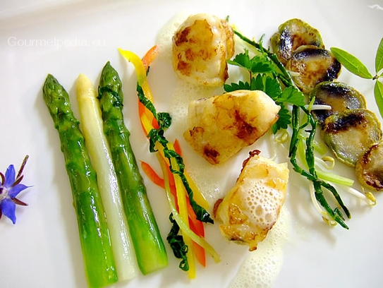 Pan seared angler-fish medallions with glazed vegetables and cubio potatoes
