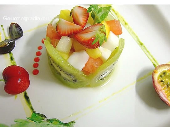Fresh fruit salat garnished with exotic fruit
