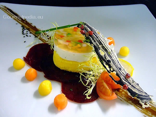 Timbale of fresh goat cheese and carrot mousse with potato pearls on beetroots carpaccio