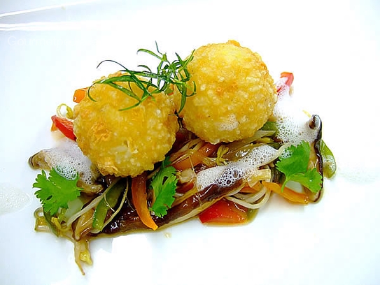 Fried rice dumplings in panko on asian vegetable ragout