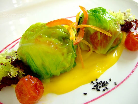 Brie and cherry tomatoes in Savoy cabbage on pumpkin cream