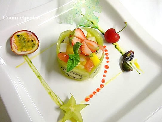 Fresh fruit salat garnished with exotic fruit
