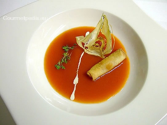 Cream of tomato soup with spring roll aromatised of basil and lime