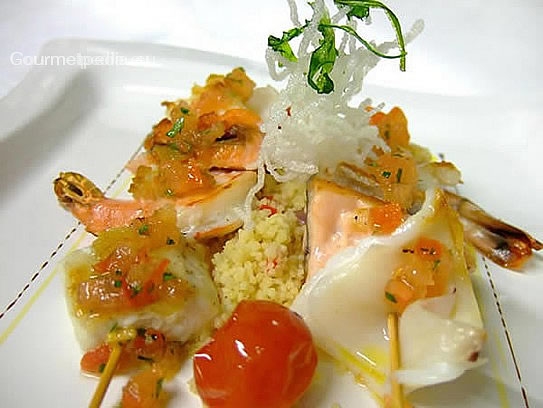 Grilled sea-fish en brochettes on pepper couscous