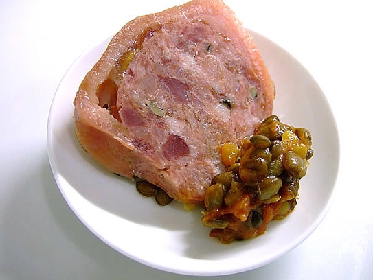 Stuffed pig's trotter on stewed lentils