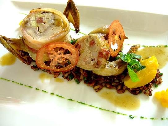 Stuffed quail in bacon on red rice and mashed pumpkin