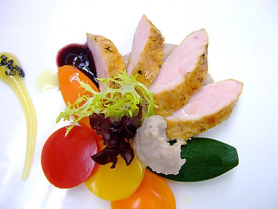 Roast turkey breast on coloured vegetable with red wine sauce and celerie rave cream