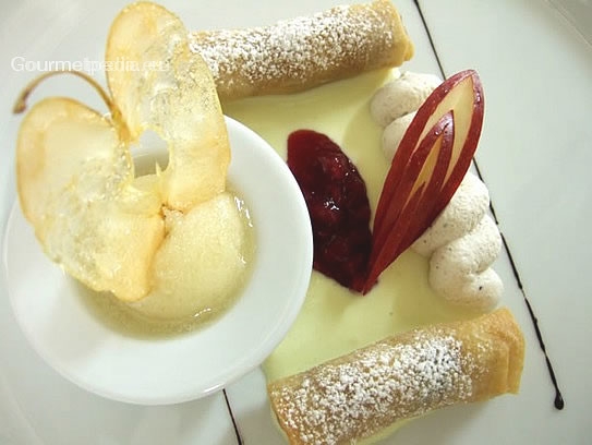 Apple spring rolls with whipped cinnamon cream and apple sherbet