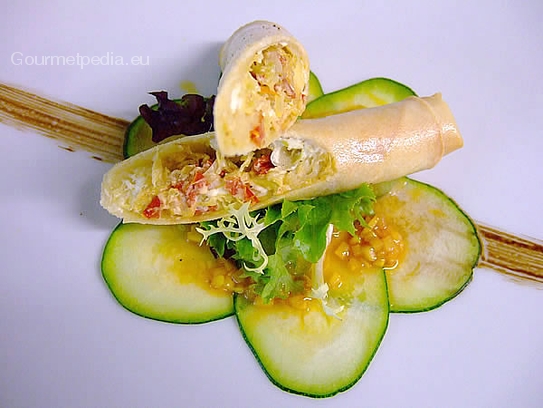 Crispy spring roll stuffed with cabbage and feta-cheese on grilled courgettes carpaccio