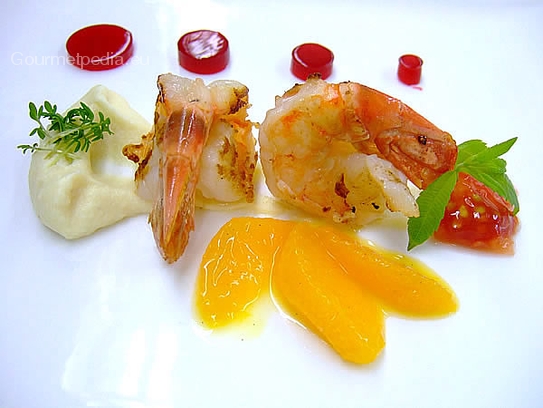 Grilled king prawns on celeriac purée aromatised with lemon verbena, orange salad and tomato jelly