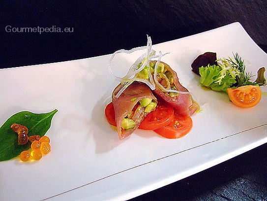 Roulades of tuna filled with avocado on tomato carpaccio and trout caviar